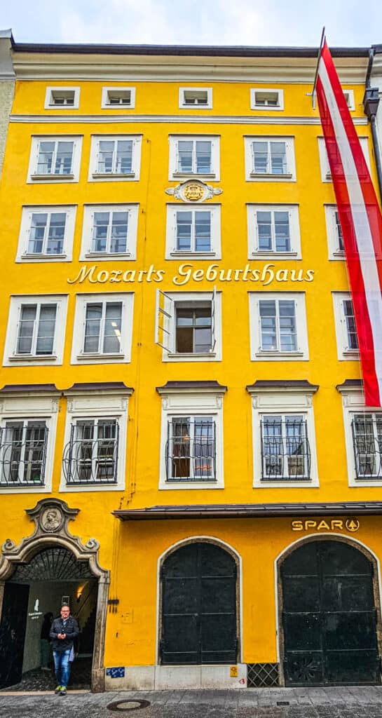 yellow exterior of mozarts house of birth salzburg