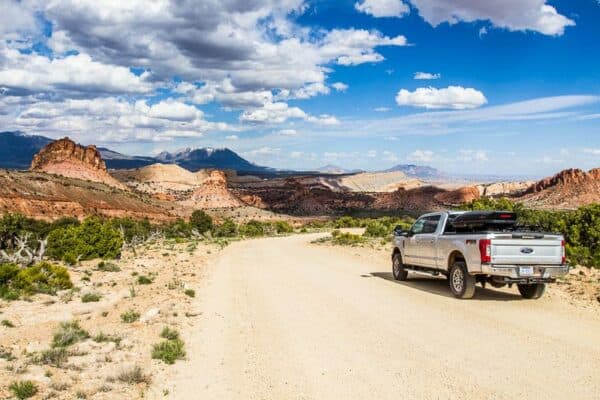 car on dirt road on Burr Trail Capitol Reef NP