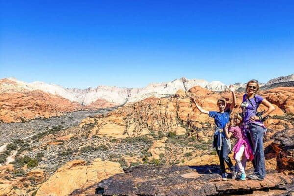 family posing in front of canyon views