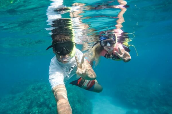 man and child snorkeling