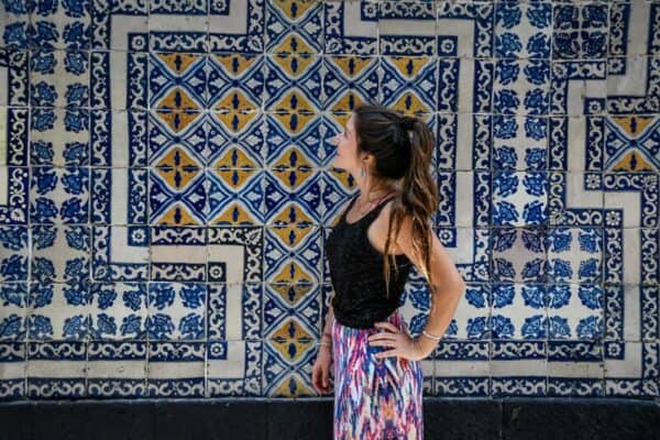 woman having photo in front of Mexico City House of Tiles