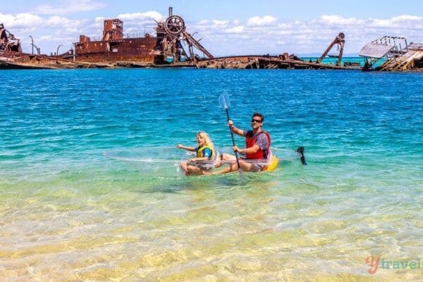 Kayaking in glass bottom kayak on Moreton Island, Queensland, Australia