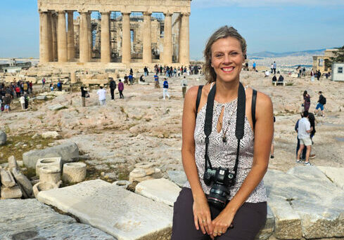 caz sitting in front of the Parthenon in Athens